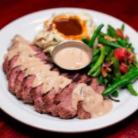 Whiskey Peppercorn Sirloin · Slow-roasted Joe's Steak® sliced and topped with a Whiskey Peppercorn cream sauce. Served wi...