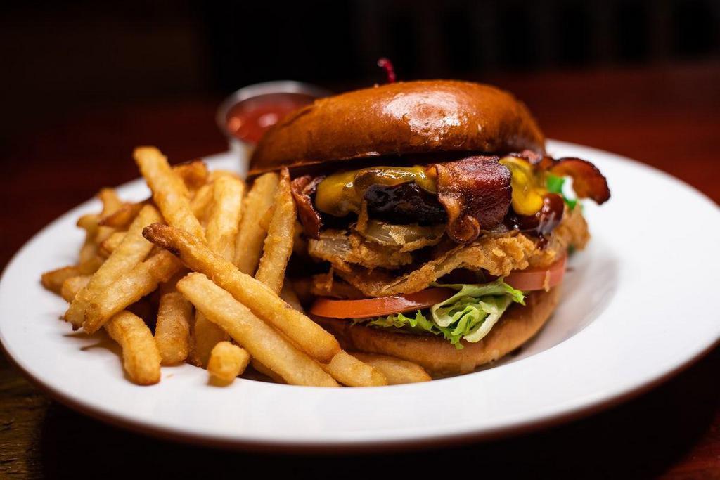 Smoke House Bbq Burger · Applewood-smoked bacon, cheddar cheese, hand-breaded onion strings and BBQ sauce.