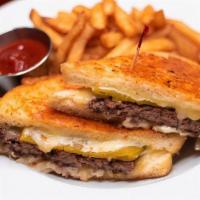 Sourdough Melt · A pan-seared burger topped with Monterey Jack cheese, sautéed onions and a green chile on Jo...