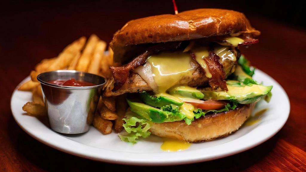 California Chicken Sandwich · A wood-grilled chicken breast topped with Monterey Jack cheese and crisp bacon along with sliced avocado, Honey Mustard dressing, lettuce and tomato
