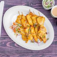 Chicken Satay Theory · Marinated chicken skewered and grilled, and served with dipping sauce.