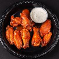 Buffalo Wings · Chicken wings on the bone, tossed in a traditional buffalo sauce, and served with a side of ...