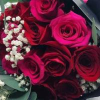 True Love Bouquet · A mix of pink and red roses wrapped in black paper.
Each arrangement includes a  card with a...