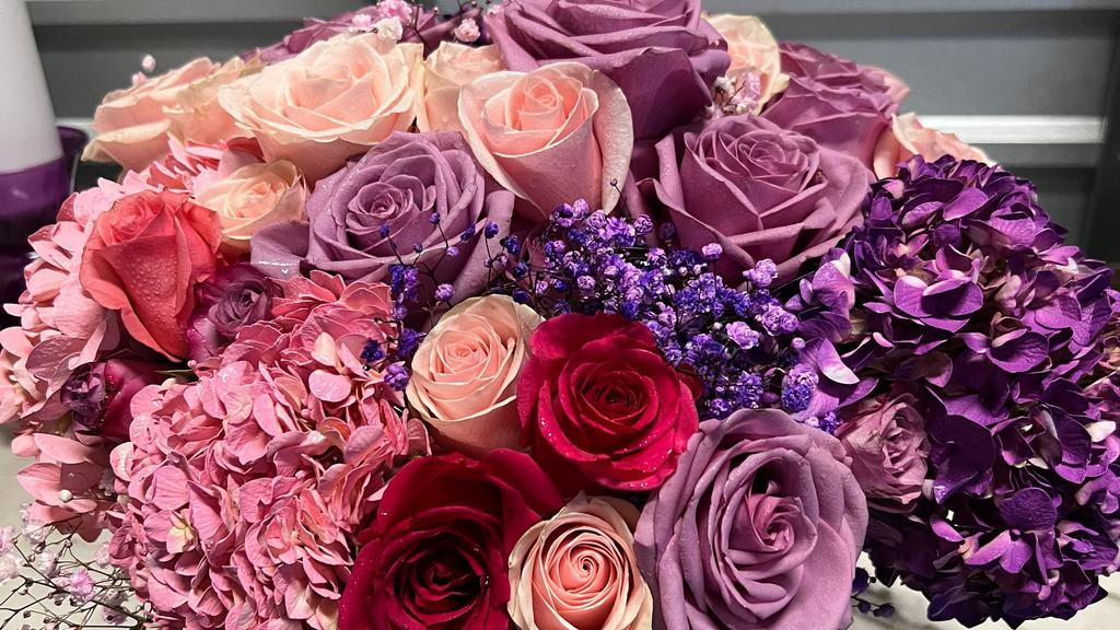 Paris To Rome  · A mix of purple , lavender and pink hydrangeas and roses in a beautiful vase.

Each arrangement includes a  card with a typed message.
**If you would like a message on the card please type it on 