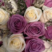 Beautiful Mauve   · White and purple roses in a solid vase. 

Each arrangement includes a  card with a typed mes...