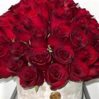 Love Is Red · 55-60 deep red roses arranged in our grey cement vase. Perfect for all occasions.
**please a...