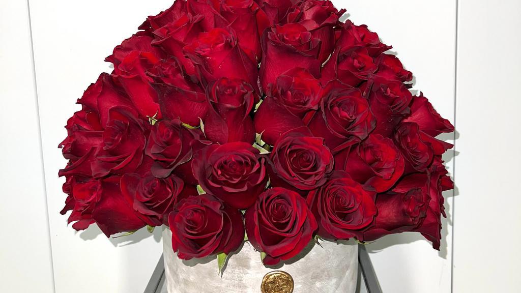 Love Is Red · 55-60 deep red roses arranged in our grey cement vase. Perfect for all occasions.
**please add what you would like written on the card in the special requests***