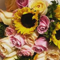 The Sunflower Dream · A mix of 5 sunflowers and  12 light pink and white roses boquet wrapped in our black paper. ...