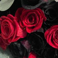 The Black & Red Bouquet · Mix of a 12 red (6) and black (6)  roses. 
Each arrangement includes a  card with a typed me...