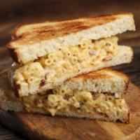 The Gold Standard · Classic mac and cheese with diced bacon on white bread.