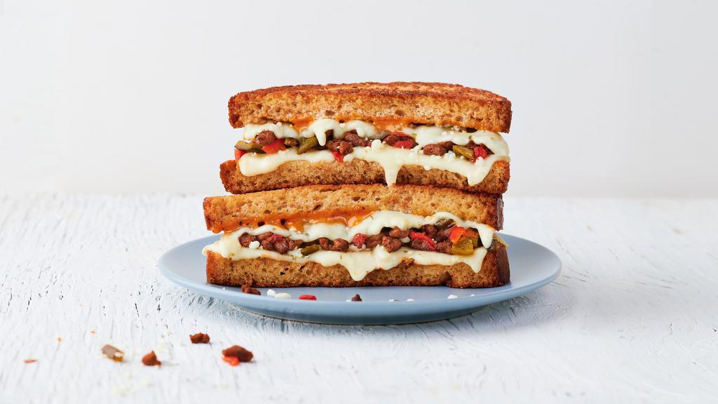 The Special · Chorizo, queso fresco, pepper jack cheese, roasted jalapenos and red peppers mix & Society Sauce on wheat bread.