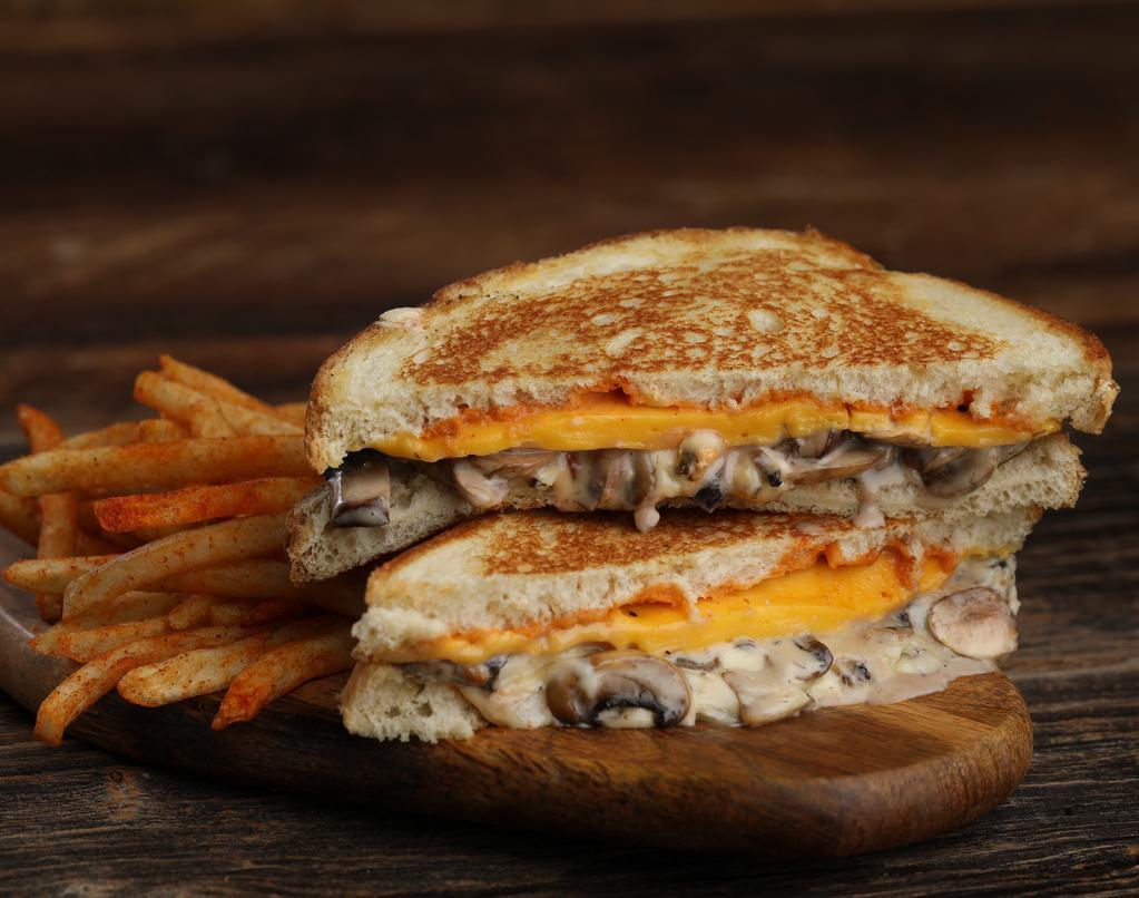 King Kong · Mushrooms sautéed in sambuca cream sauce, grilled onions, pepper jack cheese, American cheese and society sauce on white bread.