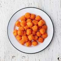 Sweet Potato Tots · Golden fried tots, crispy on the outside and soft on the inside.