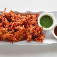 Vegetable Pakoras · Delicately, spiced, mixed vegetable fritters, cooked in vegetable oil.