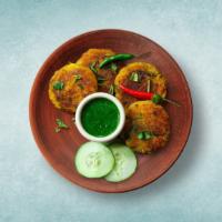 Spiced Potato Patty · Boiled potatoes, aromatic spices, and herbs mixed patties fried till golden and crisp. Serve...
