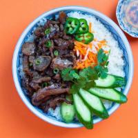 Vietnamese Pork Belly Bowl · Our Vietnamese bowl topped with tender pork belly,  cucumber, shredded carrots, cilantro, pi...