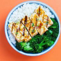 Tofu Teriyaki Bowl · Our tofu teriyaki bowl with your choice of base and topped with broccoli, scallions, sesame ...