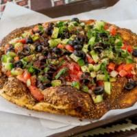 Zatar With Veggie Flat · fresh vegetable on the  top
tomatoes,cucumber,olives,mint,onions
