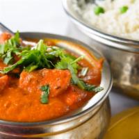 Chicken Tikka Masala · Boneless chicken barbecued in tandoori oven, then cooked with bell pepper, cream and spices.