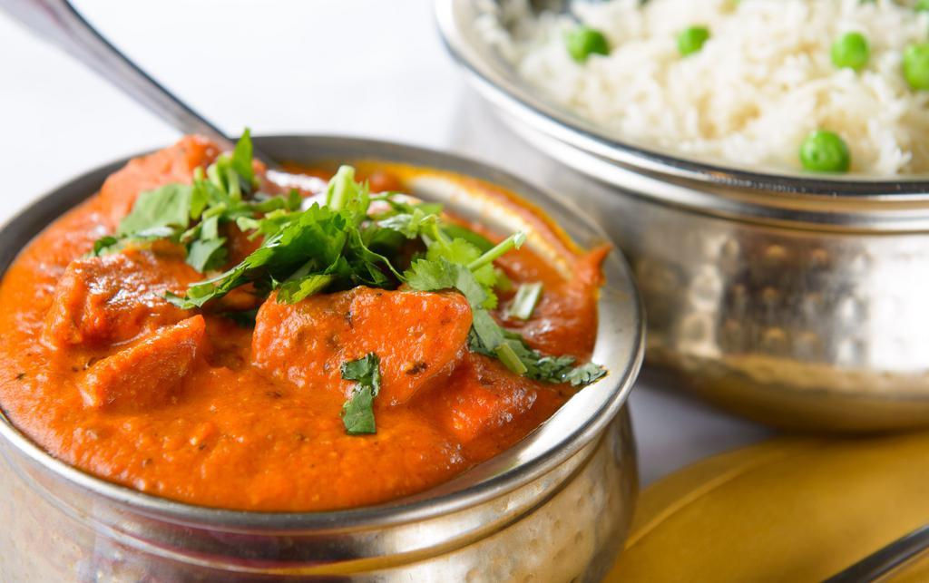 Chicken Tikka Masala · Charcoal roasted boneless chicken cubes cooked with herbs and spices in a special creamy sauce.