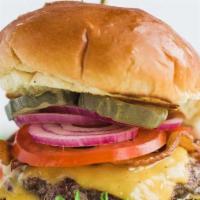 Classic Cheeseburger · Lettuce, Thousand Island, Beef Patty, American Cheese, Mayo, Pickles, Onions & Tomatoes.