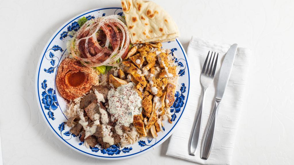 Combo Platter · Chicken, Gyro, Salad, Rice, Hummus, Tzatziki Sauce, Tahini Sauce and Pita Bread.