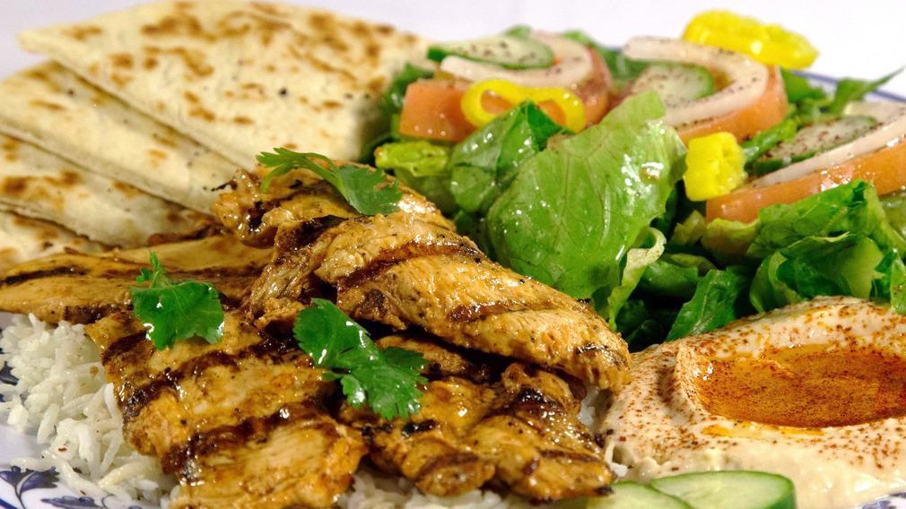 Chicken Platter · Chicken, Salad, Rice, Hummus, Tzatziki Sauce, Tahini Sauce and Pita Bread.