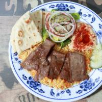Gyro Platter · Gyro, Salad, Rice, Hummus, Tzatziki Sauce, Tahini Sauce and Pita Bread.
