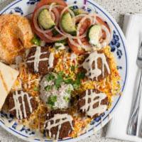 Falafel Platter · Falafel, Salad, Rice, Hummus, Tzatziki Sauce, Tahini Sauce and Pita Bread.