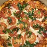 Margarita Pizza · Roma tomatoes fresh basil garlic.