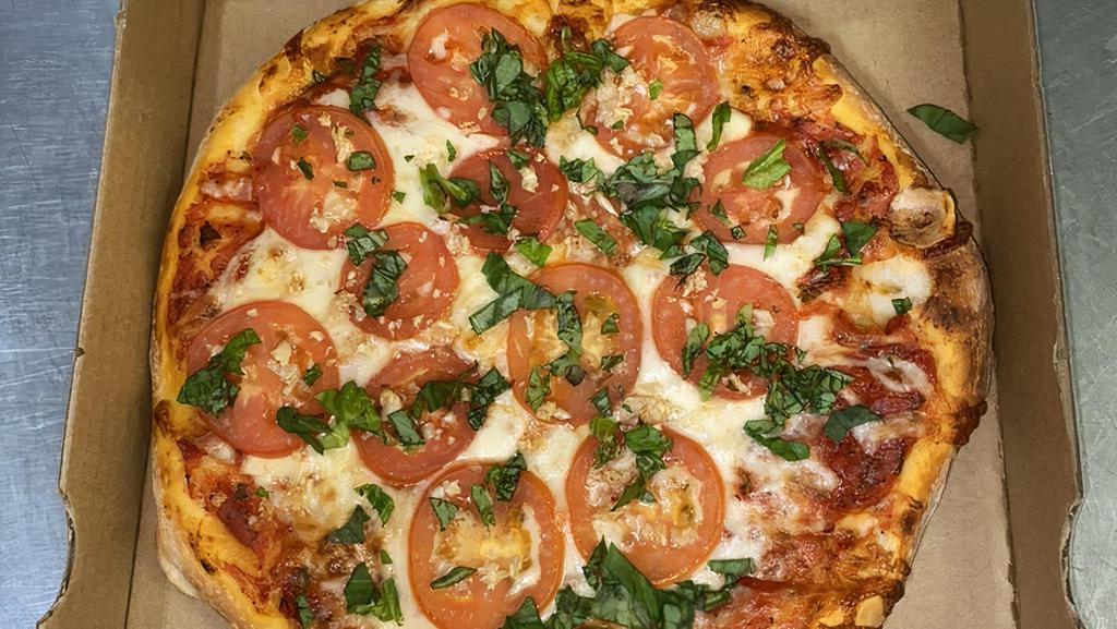 Margarita Pizza · Roma tomatoes fresh basil garlic.