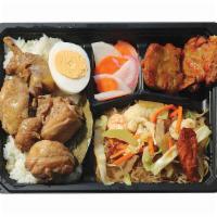 Chicken Adobo Bento Bx · Served with Pancit Bihon, Fish Fritters, Pickled Radish, and Rice.