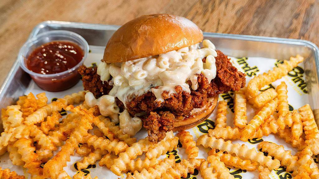 Mac Daddy Sandwich & Fries · 7oz chicken breast, spiced with your choice of heat, topped with mac n’ cheese and comeback sauce. Served with spicy fries and one sauce.