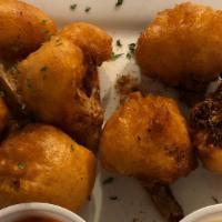 Buffalo Cauliflower · Deep fried IPA beer battered cauliflower, Cajun spices, frank's red hot sauce, ranch.