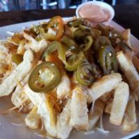 Los Iron Fries · House cut French fries torched cheese pickles jalapeños, spicy mayo.