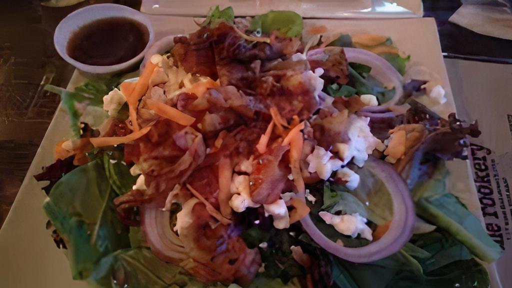 Bacon & Goat Cheese Salad · Crispy bacon, goat cheese, pecans, red onion, sliced tomato, spring mix salad.