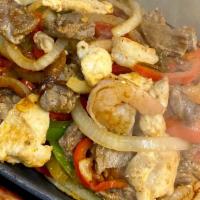 Mixed Fajitas · Sizzling platter of grilled steak or chicken and shrimp, mixed with bacon, bell peppers, oni...