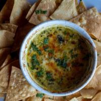 Spinach Artichoke Dip · House blend of spinach, three types of cheese, and seasoning. Served with our fresh house-ma...