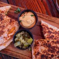 Quesadilla · Your choice of protein with cheese between warm crispy tortillas, with a side of pickles and...