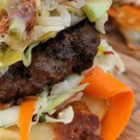Pupusa Burger · Authentic Queso con Loroco Pupusas with Angus Beef Patty and Central American Slaw served wi...