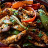 Fajitas · Medley of seasoning, bell peppers, onions and your choice of:
Grilled Chicken or Veggie (Mus...