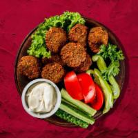 Falafel Plate Forever · Our house-made falafel served over rice with fresh salad. Comes with white sauce and ketchup.