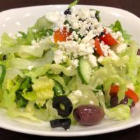 Greek Salad · Romaine Hearts, Spinach, Persian Cucumber, Grape Tomatoes, Kalamata Olives,  Sliced Black Ol...