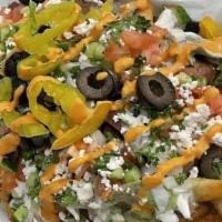 Mediterranean Gyro Fries · Fries topped with gyro slices, garlic sauce, tomatoes, onion, cucumbers, olives, and feta ch...