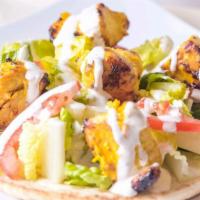 Chicken Shawarma · Pita bread with layer of housemade avocado hummus topped with eggplant salsa, chipotle tahin...