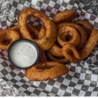 Beer Battered Onion Rings · Sweet Spanish onions thick-cut, double dipped in beer batter and fried crispy.