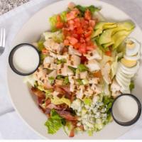 Mels Cobb Salad · Lettuce, chopped bacon, diced chicken, avocado, green onions, egg, tomato, and bleu cheese c...