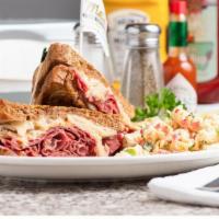 Reuben · Corned beef with Swiss cheese, sauerkraut, and Thousand island dressing on grilled rye.