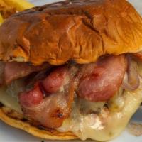 Wagyu Bacon Cheeseburger · Applewood smoked bacon, provolone cheese, sautéed onions, Hawaiian roll, served with hand-cu...