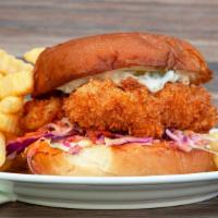 Crispy Fish Sandwich & Fries · Ale-battered wild pacific cod, shaved cabbage, pickles & tartar sauce